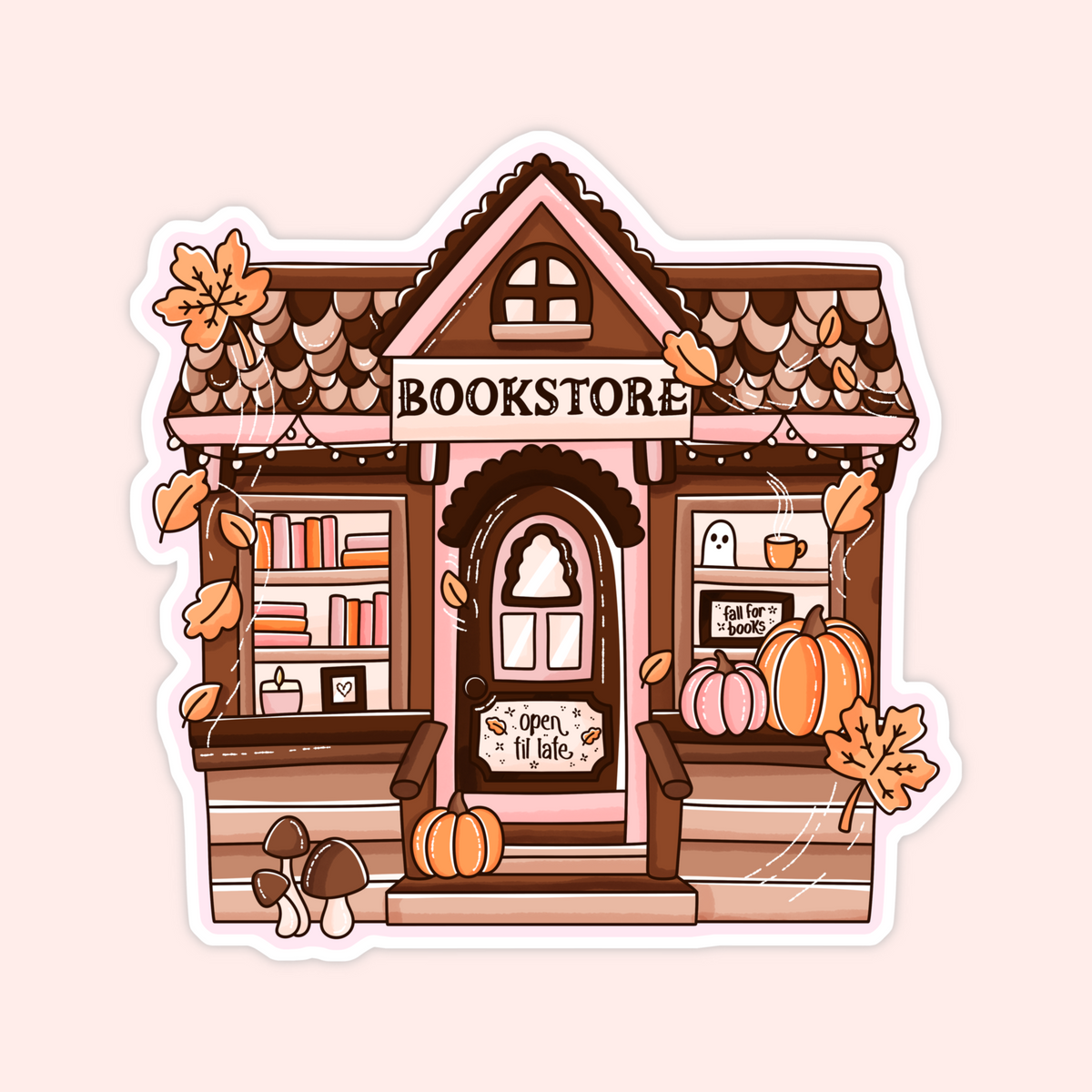 A die-cut sticker featuring a cute autumn-themed illustration of a cozy bookshop. The pink and brown storefront has scalloped roof tiles, a sign reading 'BOOKSTORE' above the door, pumpkins on the porch, hanging orange leaves, mushrooms, and a ghost in the window.