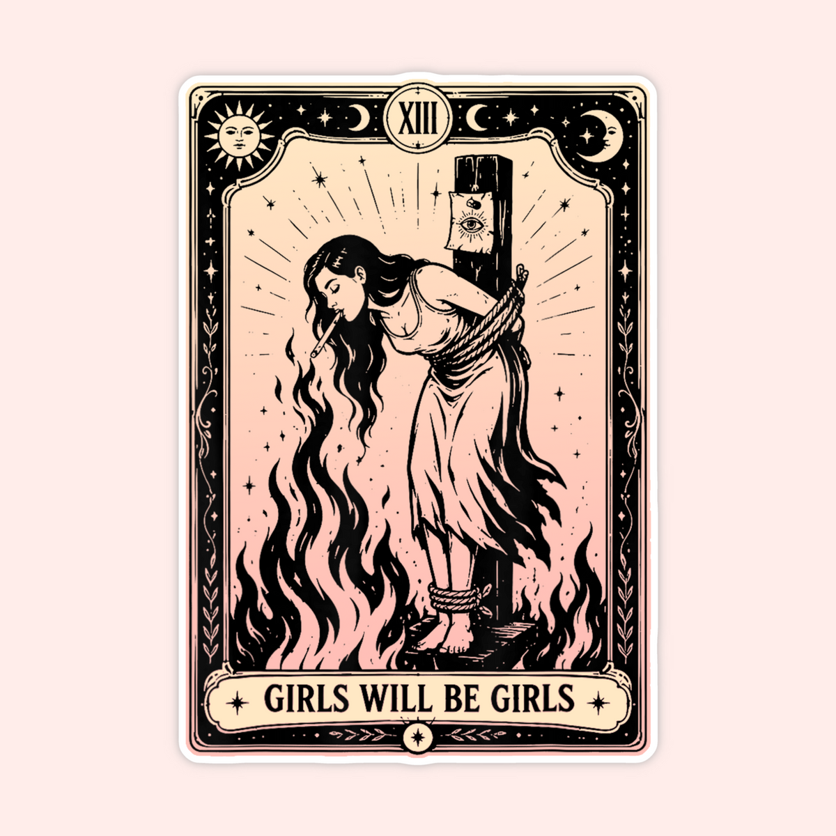 A tarot-style art print card featuring a vintage illustration of a girl bound to a pole with flames, surrounded by stars and moons. The card has a cream and black border with the text 'GIRLS WILL BE GIRLS' at the bottom, set against a solid pale pink background.