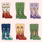 Six pairs of illustrated high-heeled boots arranged in a 2x3 grid on a pale pink background. Each pair features a different zodiac symbol and whimsical decorative motifs: Aries with flames, Taurus with flowers, Pisces with profiles, Virgo with waves, Leo with flames, and Capricorn with floral details.