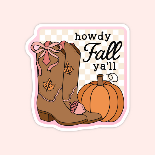 A die-cut sticker featuring autumn-themed illustrations, including a brown cowboy boot with a pink bow and maple leaf, an orange pumpkin, and the text 'howdy Fall ya'll'.