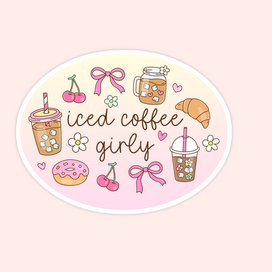 An oval sticker with a pastel gradient background featuring cute iced coffee illustrations and the text 'iced coffee girly' in brown script. The design includes pink bows, cherries, flowers, a croissant, a donut, and iced coffee cups on a pale pink background.