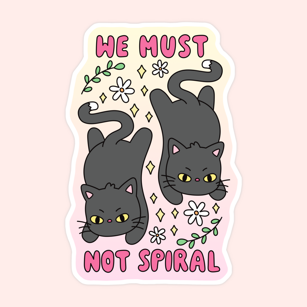 A die-cut sticker featuring two cartoon dark gray cats with yellow eyes and pink noses, surrounded by white flowers, green leaves, and sparkles, with the text 'WE MUST NOT SPIRAL' in pink lettering on a pale pink and cream background.