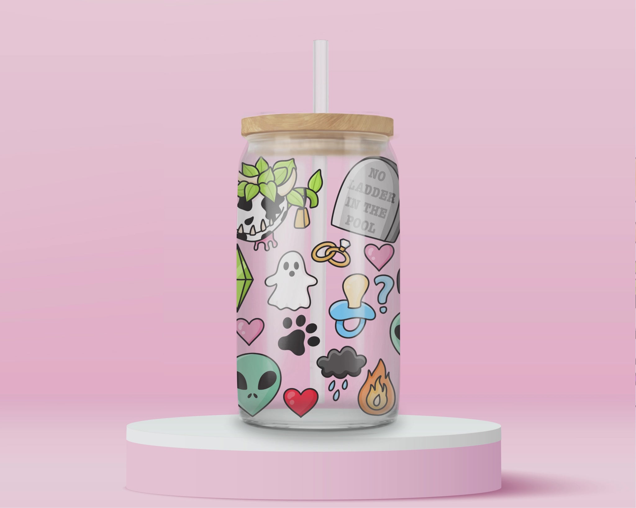 Glass cup with playful Sims-inspired icons including ghosts, plumbobs, gravestones that read “No Ladder in the Pool,” hearts, aliens, skull plants, and colorful objects.