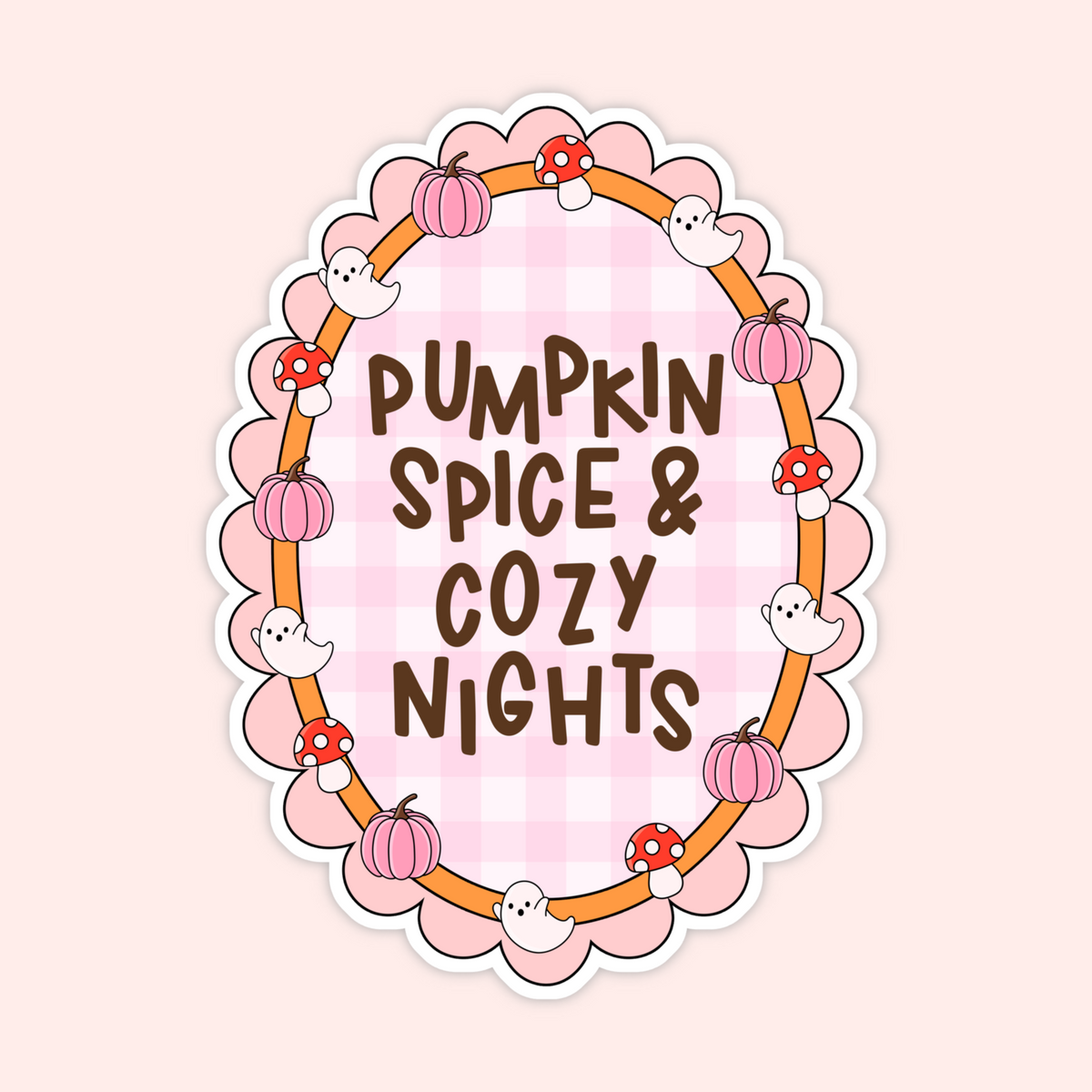 A die-cut sticker featuring a circular autumn-themed design with the text 'PUMPKIN SPICE & COZY NIGHTS' in brown lettering over a pink gingham background. The circle is decorated with cartoon pumpkins, red-and-white mushrooms, white ghosts, and an orange border, all on a pale pink background.