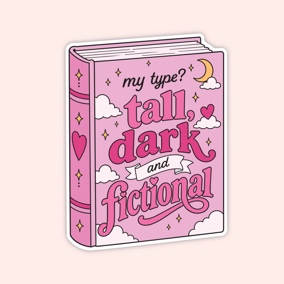 A die-cut sticker shaped like a pink hardcover book with the phrase 'my type? tall, dark and fictional' in stylized lettering, decorated with clouds, hearts, stars, and a crescent moon on a pale pink background.