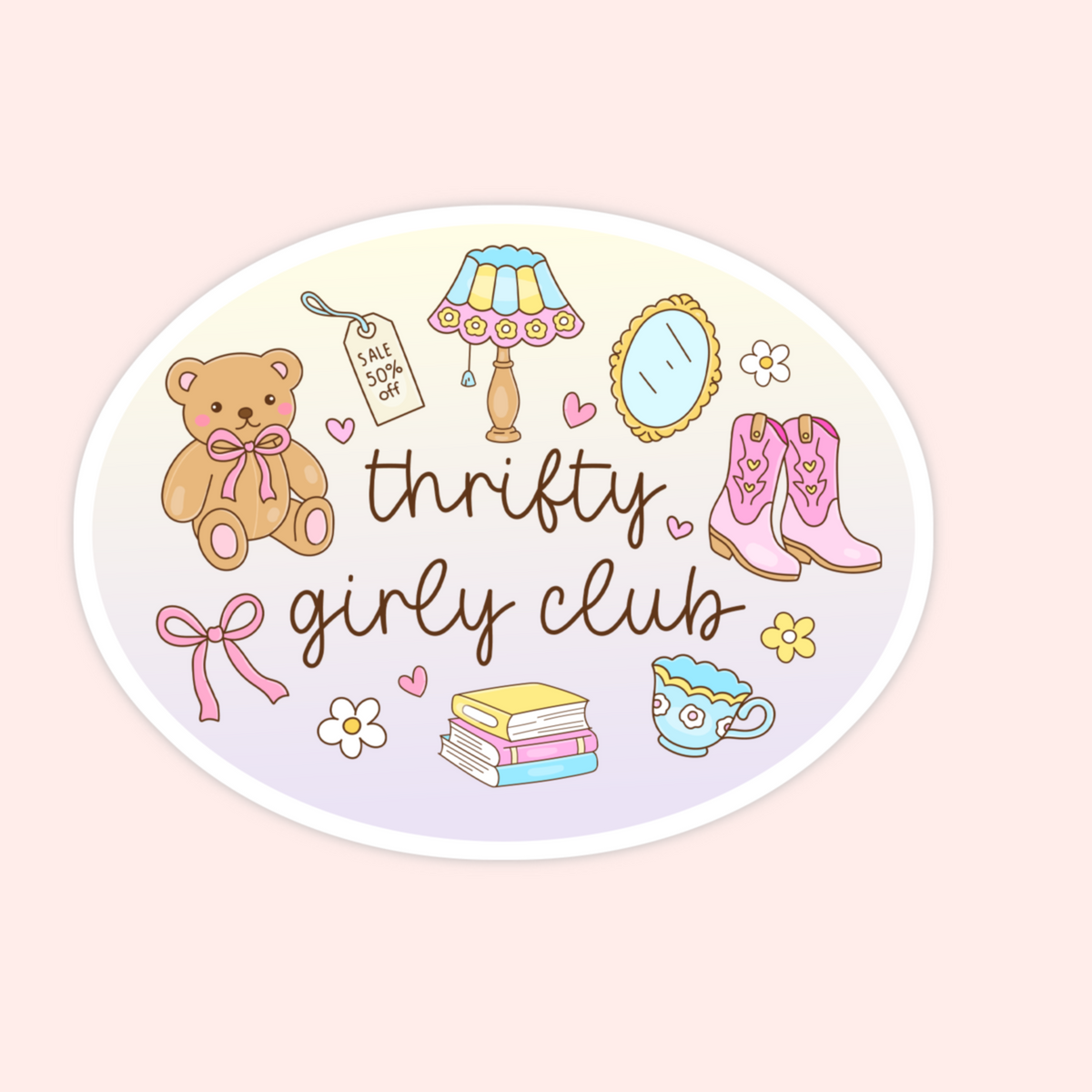 An oval sticker or decal featuring a western-themed 'Thrifty Girly Club' design on a pale pink background. The sticker illustration includes a teddy bear, cowboy boots, a lamp, a mirror, flowers, a stack of books, a teacup, and a pink bow.